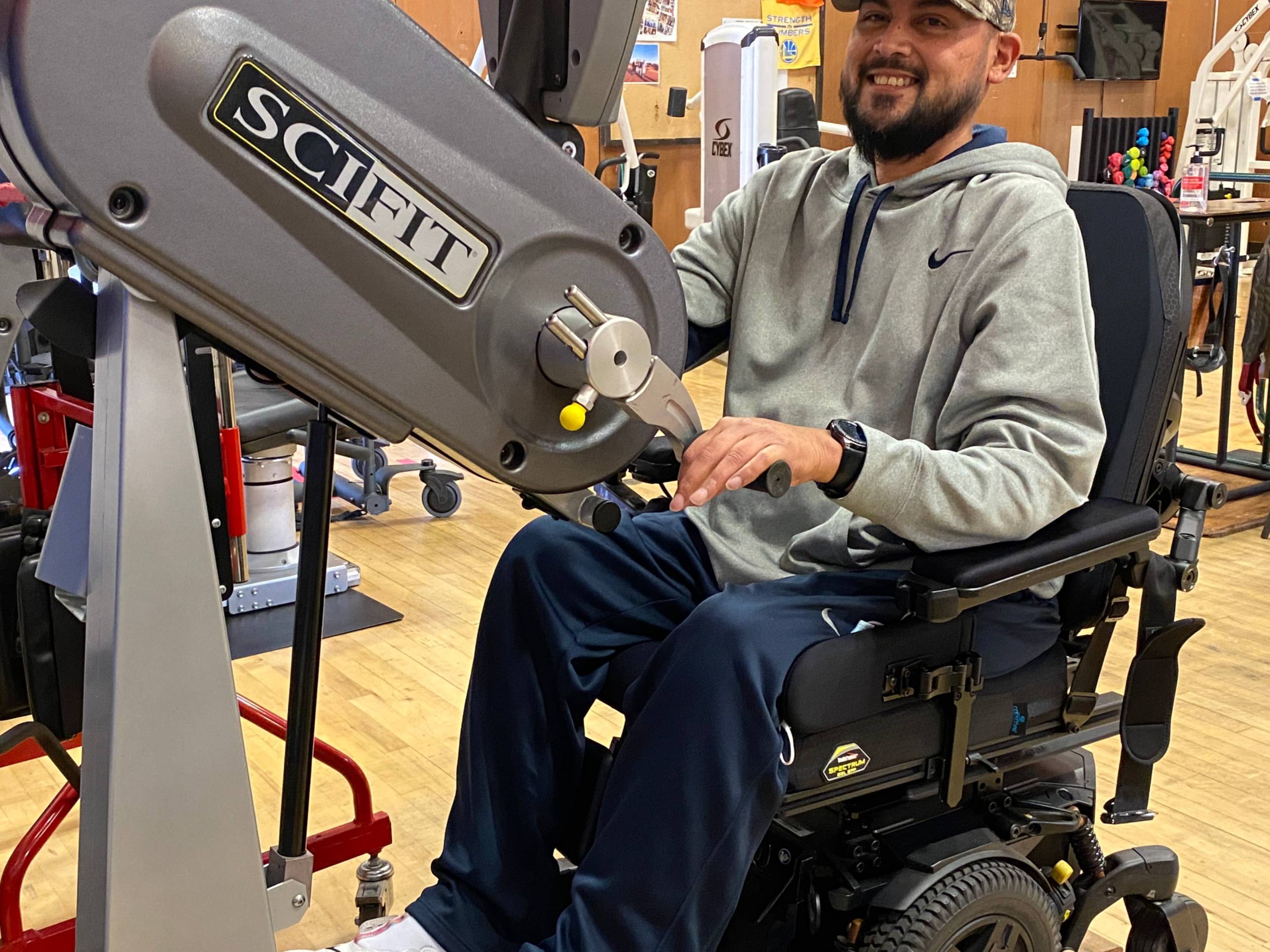 Adrian on stationary hand cycle