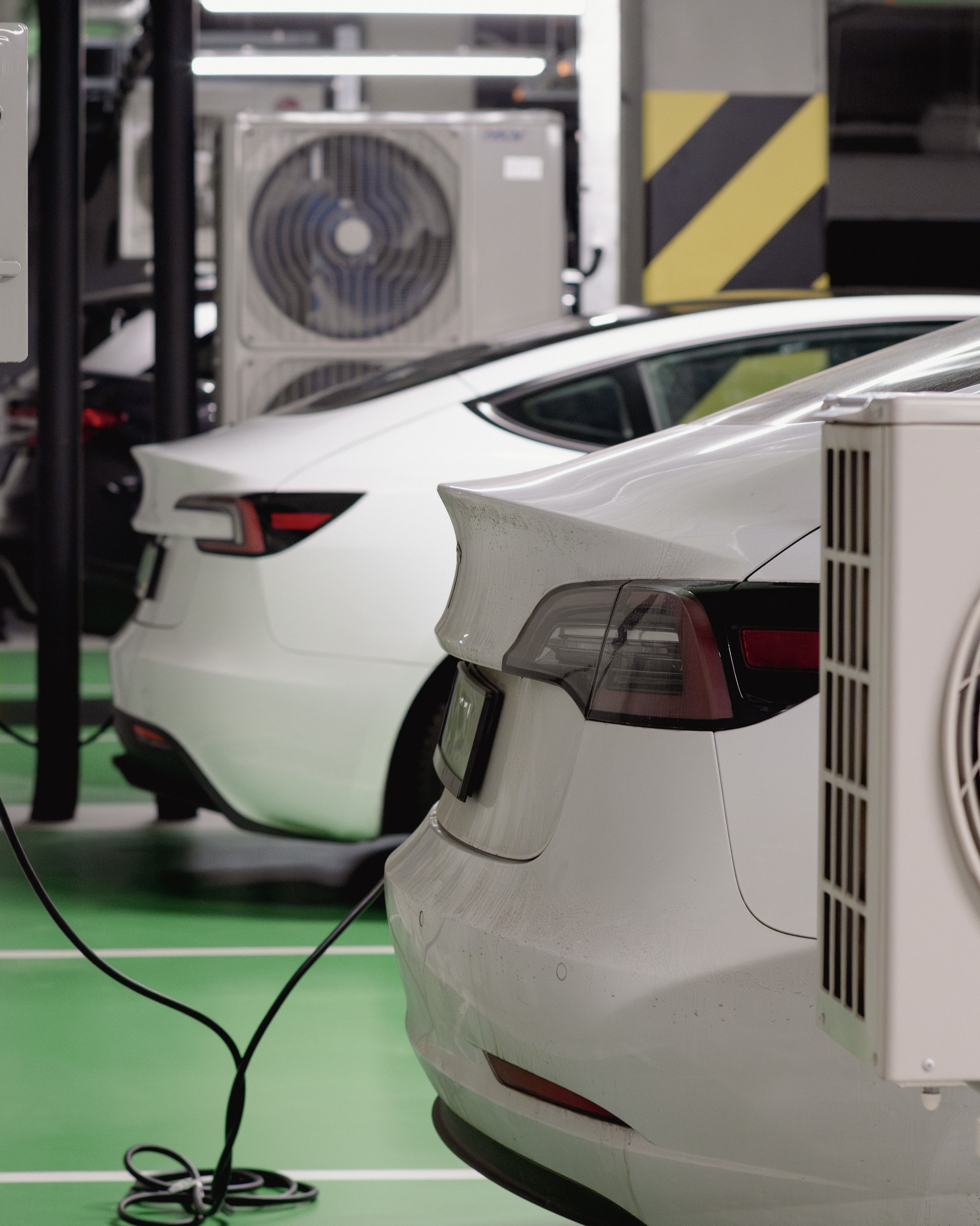 Tesla cars in an auto shop