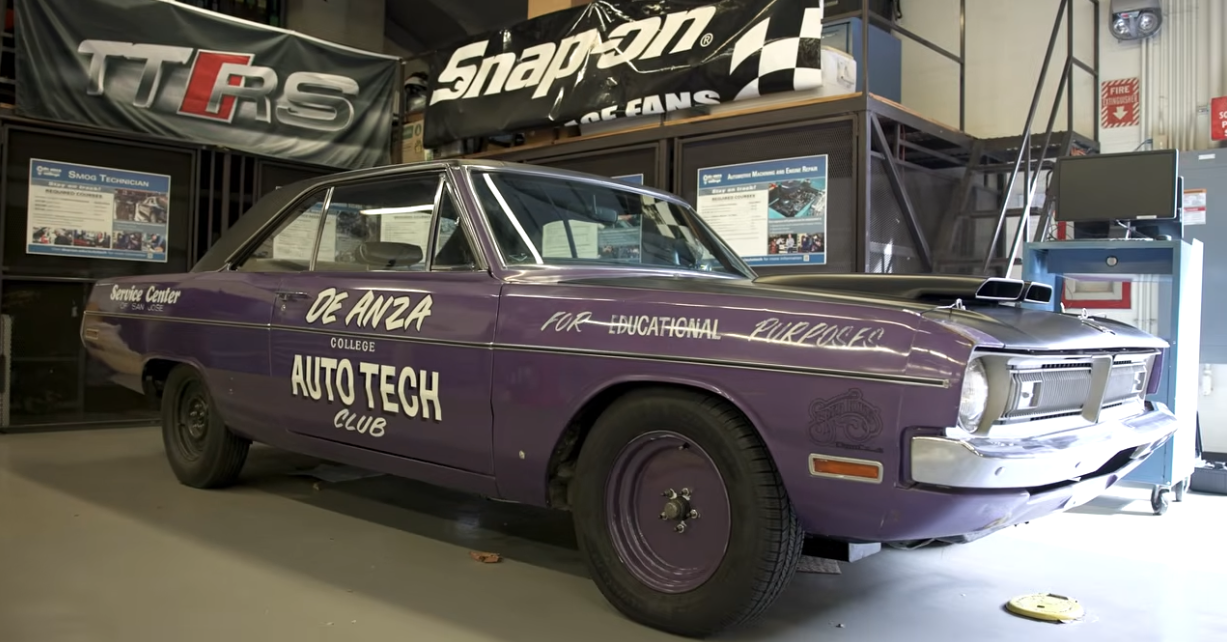A still showing a hot rod car with De Anza College Auto Tech Club lettered on the side