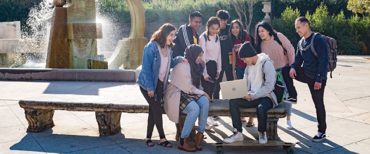 students near fountain in sunken garden
